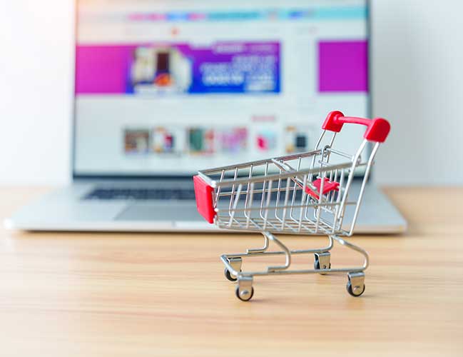 shopping-cart-and-laptop-computer-with-marketplace